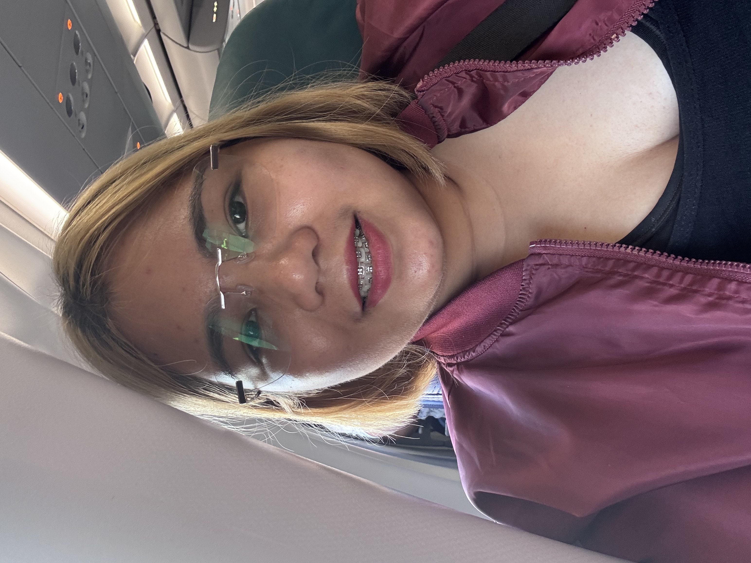 Jane in a window seat on a plane